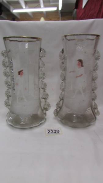 A pair of Mary Gregory style glass vases.