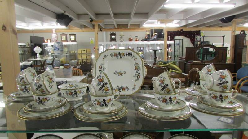 39 pieces of Aynsley bird decorated tea ware. (collect only).