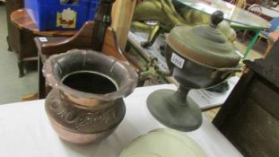 A copper jardiniere and a copper samovar urn.