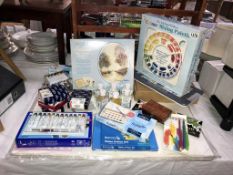 A selection of new artists materials including acrylic,