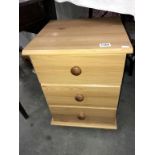 A pine effect bedside 3 drawer chest