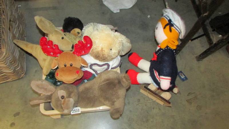 A box of assorted soft toys.
