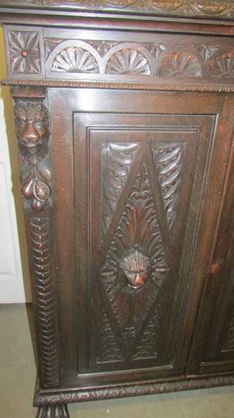 A large continental carved oak cupboard with ebony trim. (Collect only). - Image 2 of 3