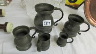 Five old pewter tankards, (some have dents).