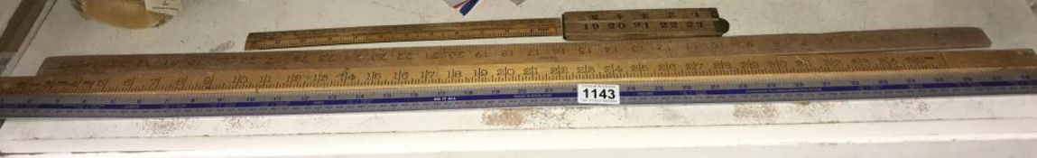 A quantity of vintage wooden rulers including Yard stick etc