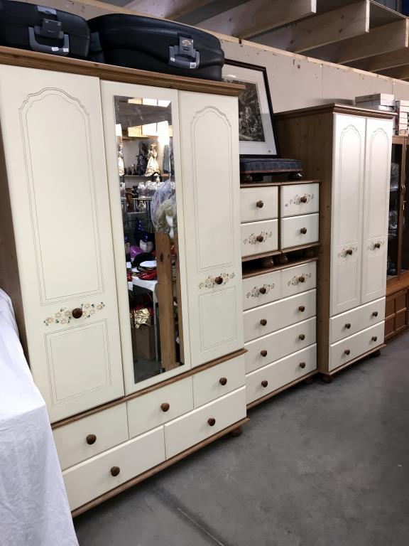 A 5 piece pine effect bedroom suite of 2 wardrobes,