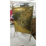 A brass fire screen. (Collect only).