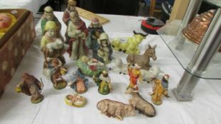 A quantity of ceramic and plastic nativity figures.