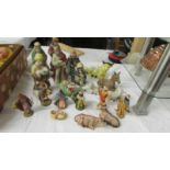 A quantity of ceramic and plastic nativity figures.