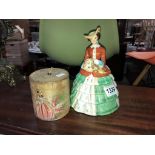 An early 20c Staffordshire pottery crinoline lady biscuit barrel and a painted boxwood string box