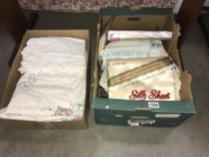 2 boxes of linen including sealed silk sheets