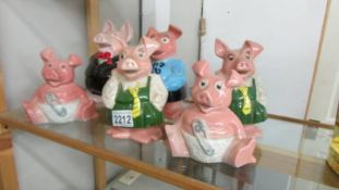 Six Wade Nat West piggy banks.