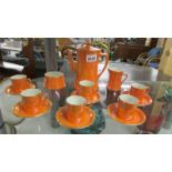 A 15 pieces Carlton Ware orange lustre coffee set (milk jug has repair).