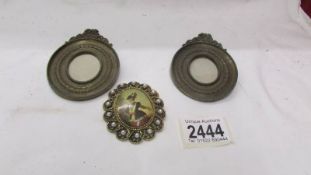 A pair of Victorian frames for miniatures and a brooch.