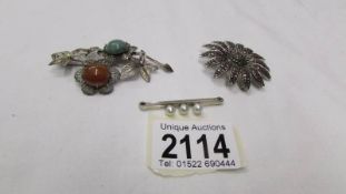 Two silver brooches and an 800 continental silver brooch.