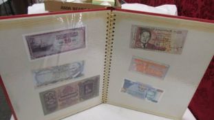 An album of 78 foreign bank notes.