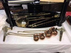 A brass chestnut roaster, 4 toasting forks, set of 4 copper measures etc,