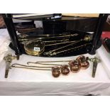 A brass chestnut roaster, 4 toasting forks, set of 4 copper measures etc,