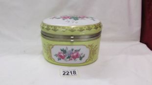 A floral decorated ceramic box.