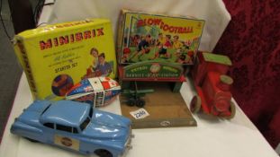 A mixed lot of vintage toys including wooden train, petrol station, building blocks etc.