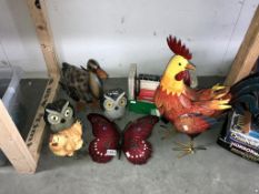 A quantity of metal and resin animal garden ornaments and a quantity of candles