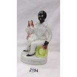 A Victorian Staffordshire figure 'Uncle Tom and Eva'.