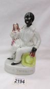 A Victorian Staffordshire figure 'Uncle Tom and Eva'.
