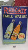 A vintage Redgate Table Waters advertising sign.