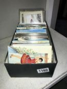 A box of mixed postcards including Spanish silks and quantity of postage stamp postcards