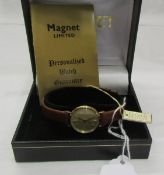 A 14ct gold ladies wrist watch.