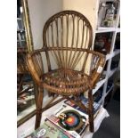 A vintage bamboo/cane arm chair