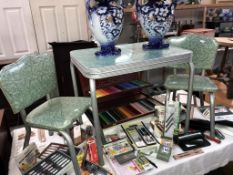 A 1950's children's garden/camping table and 2 chairs (table 61cm x 45.