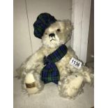 A Merrythought 2000 blond bear with growler tartan sash and hat