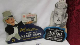 A Tapti Salt showcard advertising sign and a Moorland Bismuth Heart shape tablets showcard