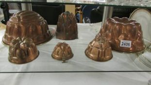Six assorted copper jelly moulds.
