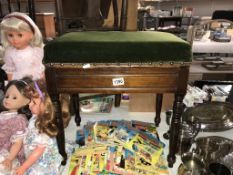 An Edwardian mahogany piano stool and contents (music books)