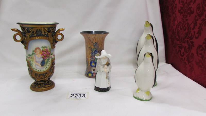 A Carlton ware vase, A Royal Worcester Nun candle snuffer,