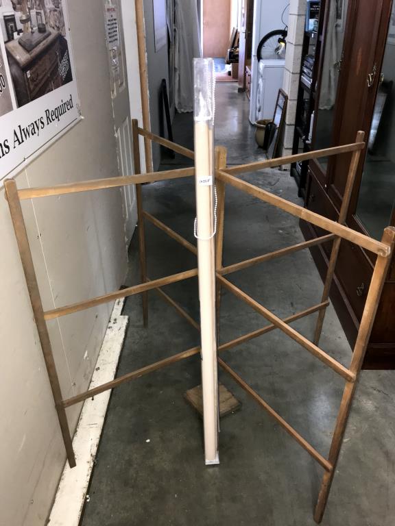 An unsealed vintage wooden clothes airer & a window blind