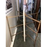 An unsealed vintage wooden clothes airer & a window blind