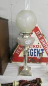 A Victorian silver plate Corinthian column oil lamp with glass font and etched shade.