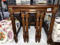 An unusual good quality dark wood nest of tables