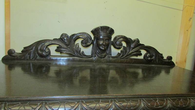 A large continental carved oak cupboard with ebony trim. (Collect only). - Image 3 of 3