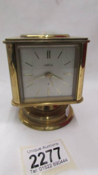An Angelus circa 1950's Swiss gilt brass portable desk clock/weather station. - Image 4 of 6