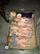 A box of old plastic dolls