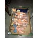 A box of old plastic dolls