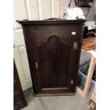 A Victorian oak corner cupboard (height 112cm)