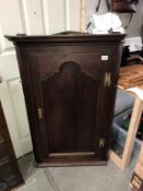 A Victorian oak corner cupboard (height 112cm)