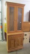 A pine two door glazed top dresser. (Collect only).
