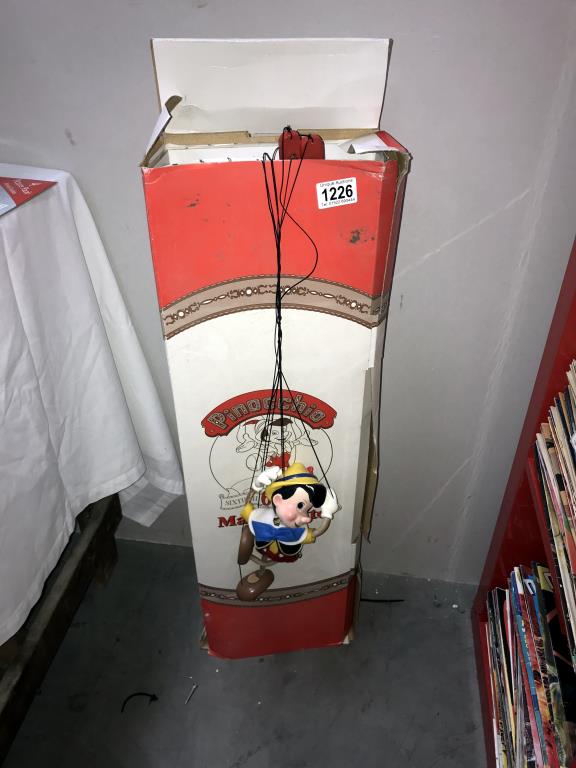 A boxed Bob Baker Pinocchio 60th Anniversary marionette puppet (no stand) strings are tangled