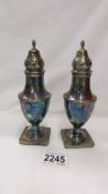 A pair of Mappin and Webb sugar sifters.